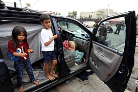 Homeless children sleeping in abandoned cars